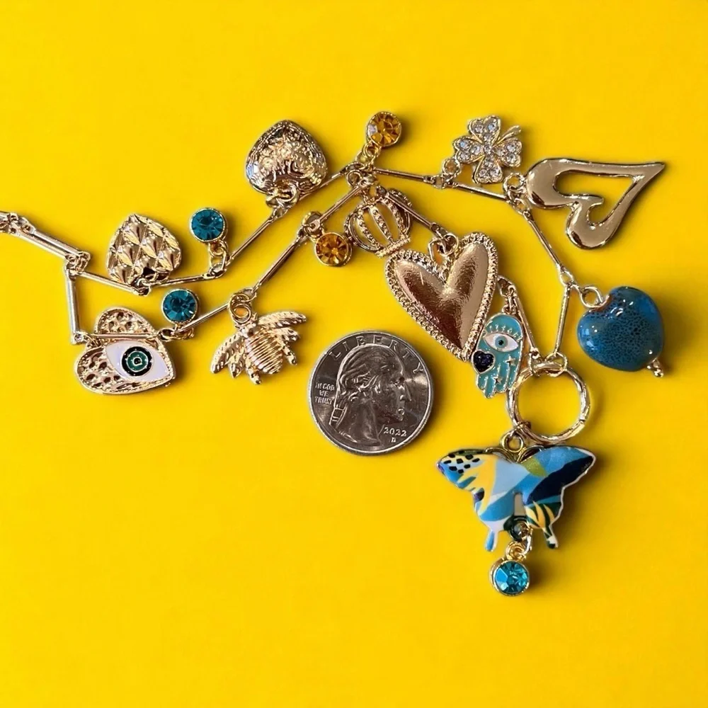 Unique and Gorgeous Gold toned Necklace with Varying Blue and Yellow Charms
